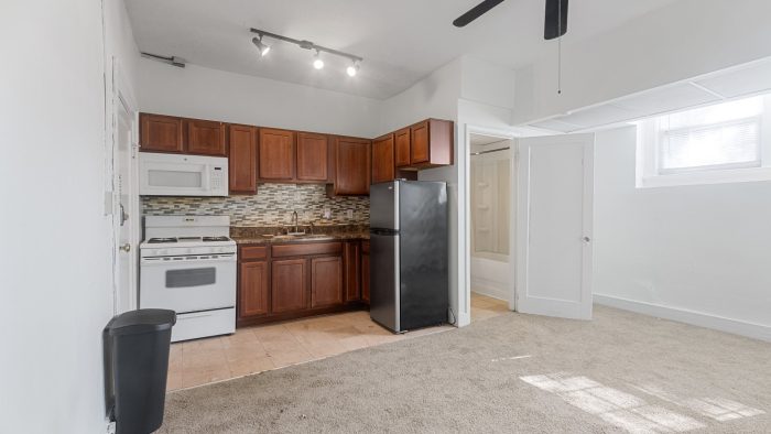 a kitchen with a ceiling fan and a microwave at The Suites of Irvington
